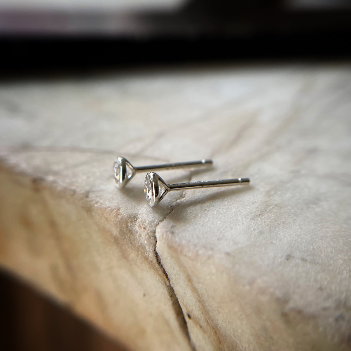 3mm sterling moissanite studs seen from the side