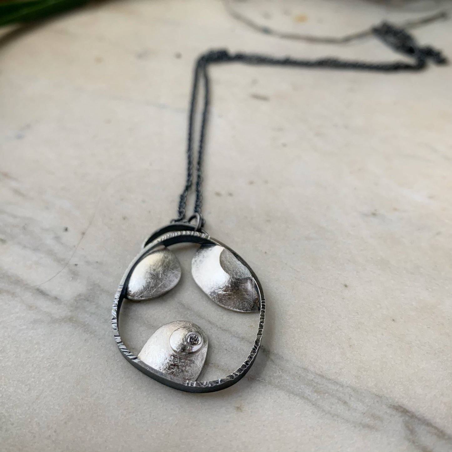 The Islands pendant, bright and oxidized