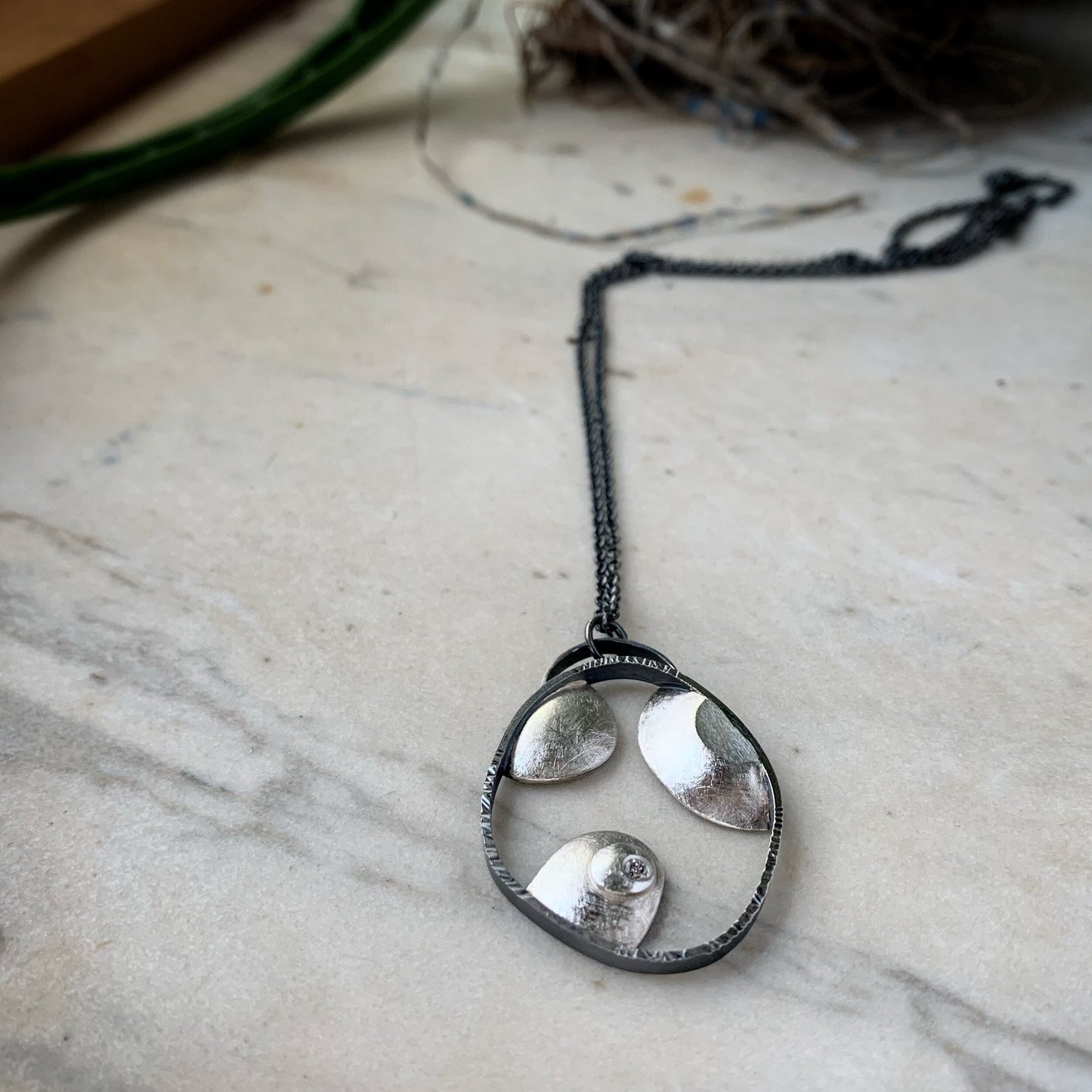 The Islands pendant, bright and oxidized