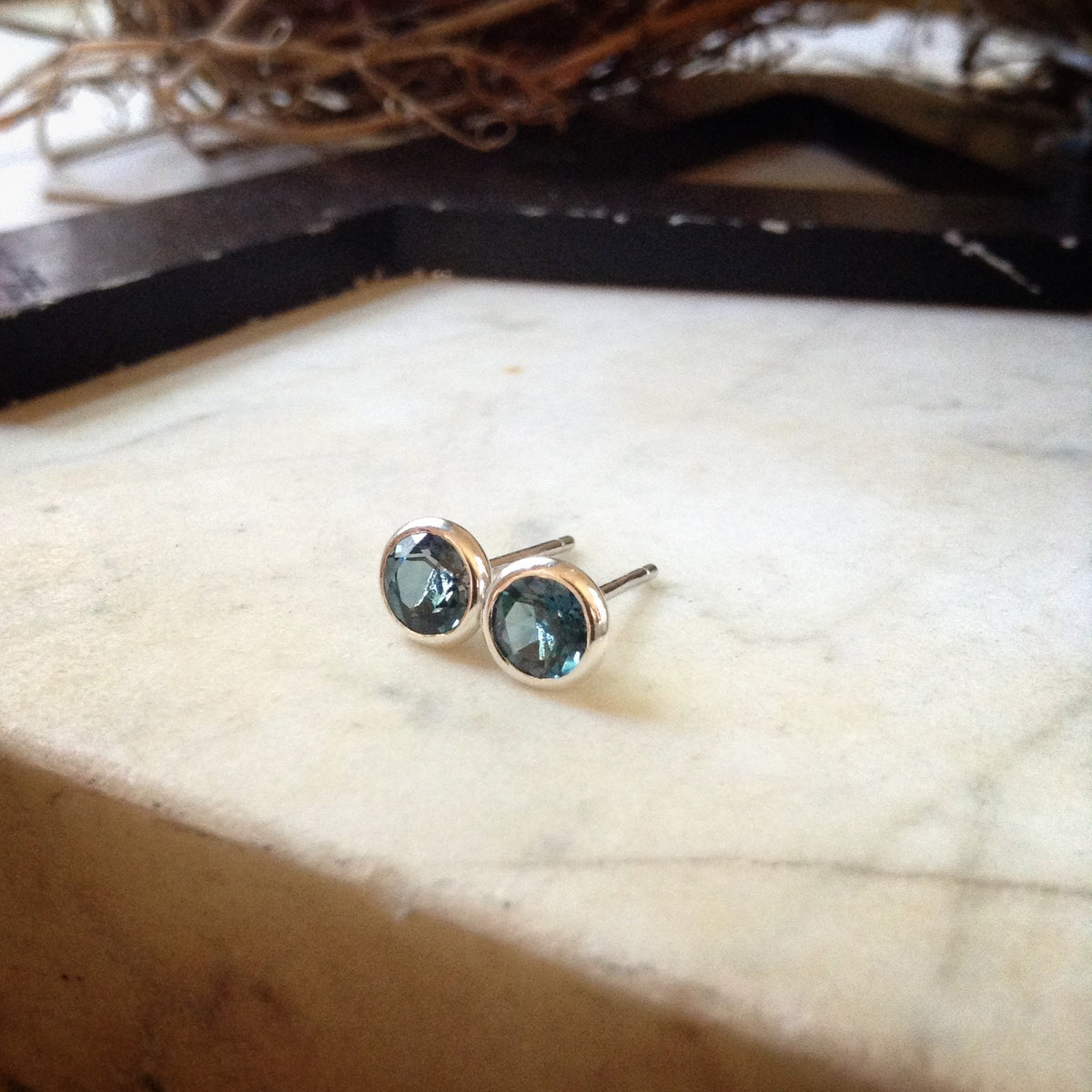 London blue topaz earrings. Bezel set in sterling silver.
