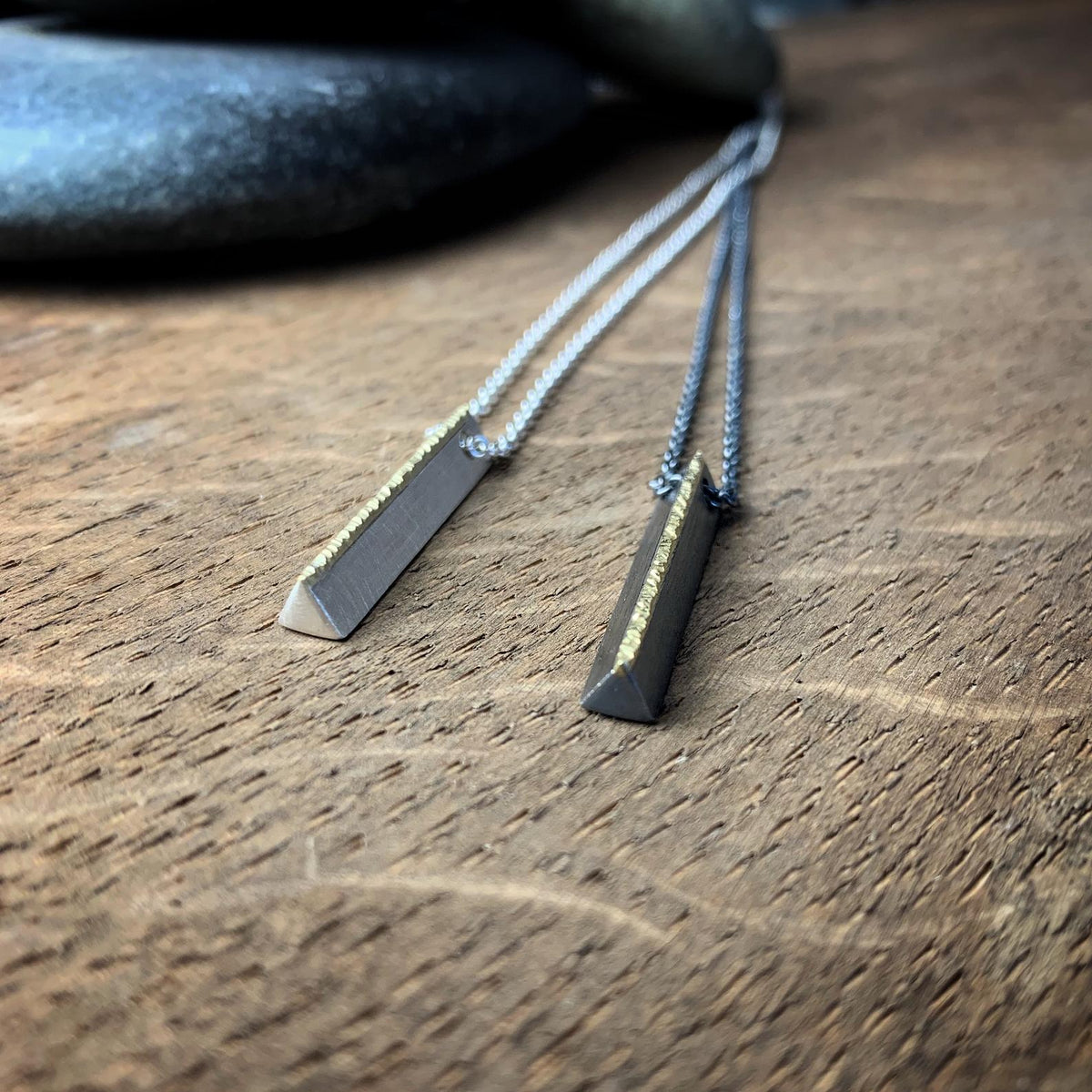 Minimal sterling silver bar pendant topped with hammered 18k yellow gold