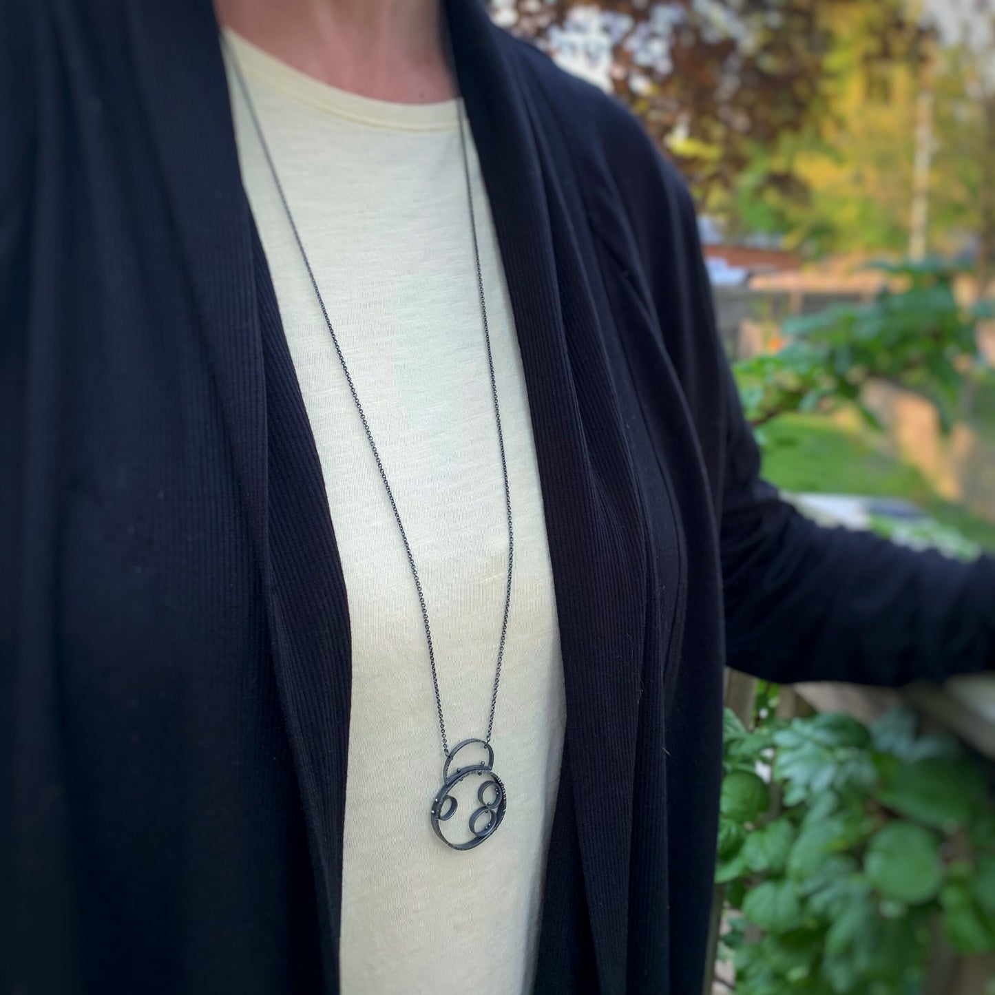 pendant shown on a model for scale