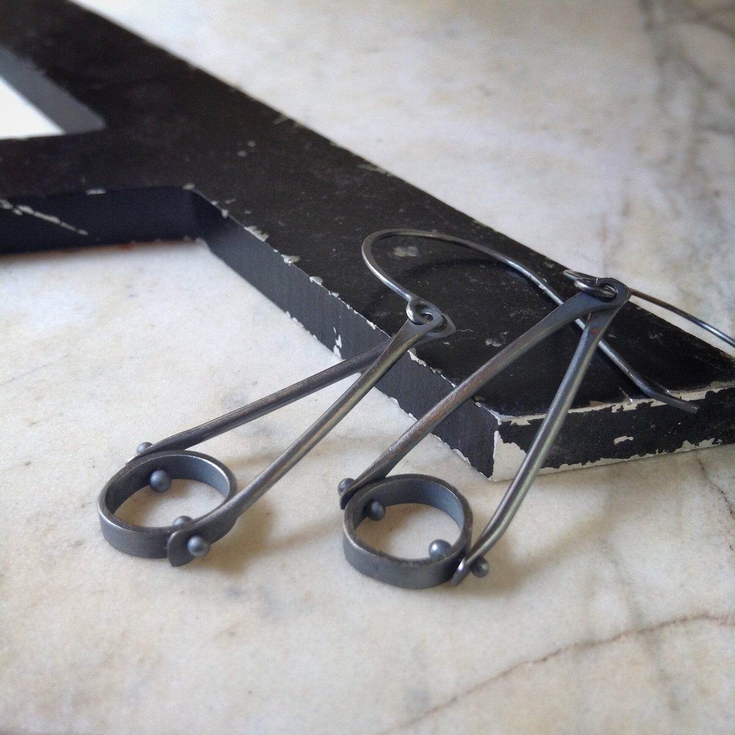 oxidized sterling silver earrings with an industrial look and organic circles