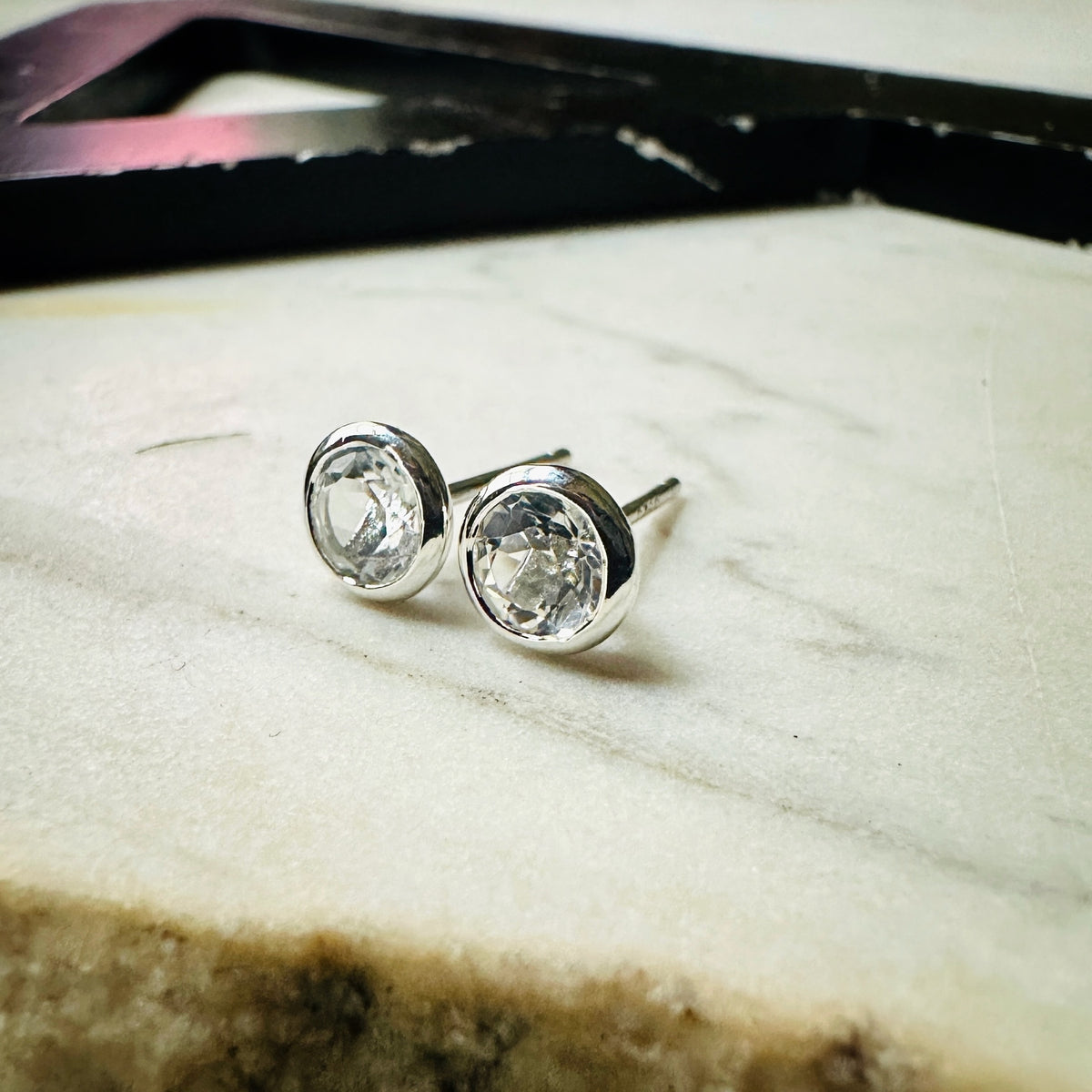 5mm white topaz bezel set stud earrings in sterling silver 