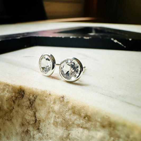 a pair of 6mm white topaz bezel set stud earrings 