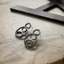 Load image into Gallery viewer, oxidized sterling earrings with gold rivets holding the circles together earrings
