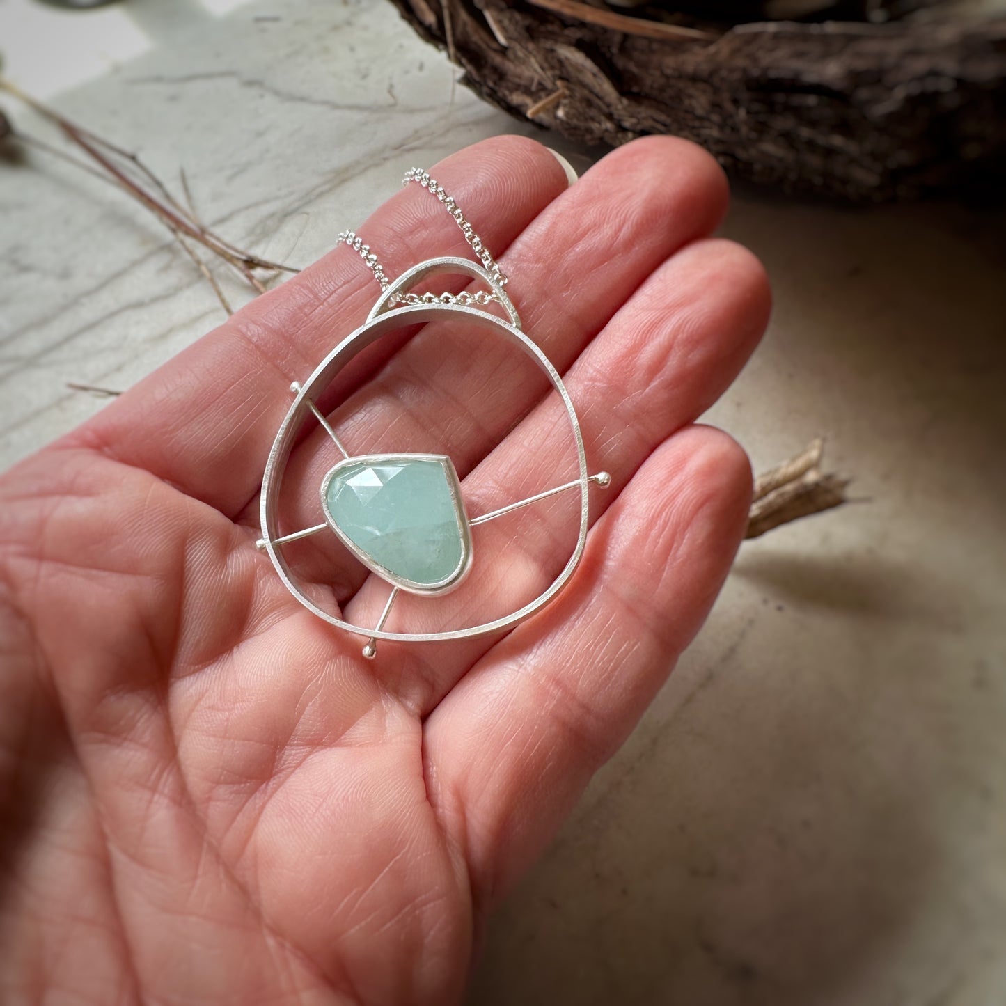 Sterling silver atomic pendant with aquamarine