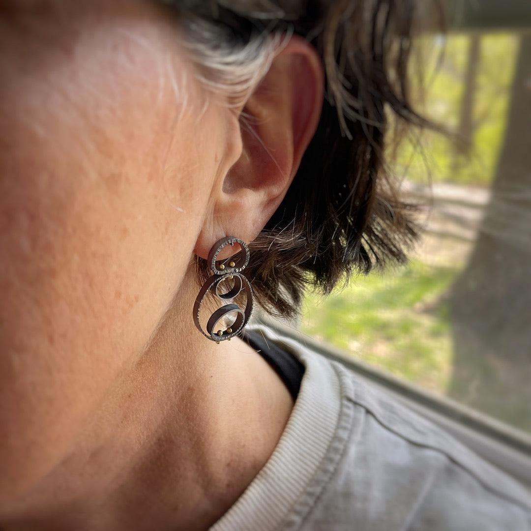 earrings shown on a model for scale