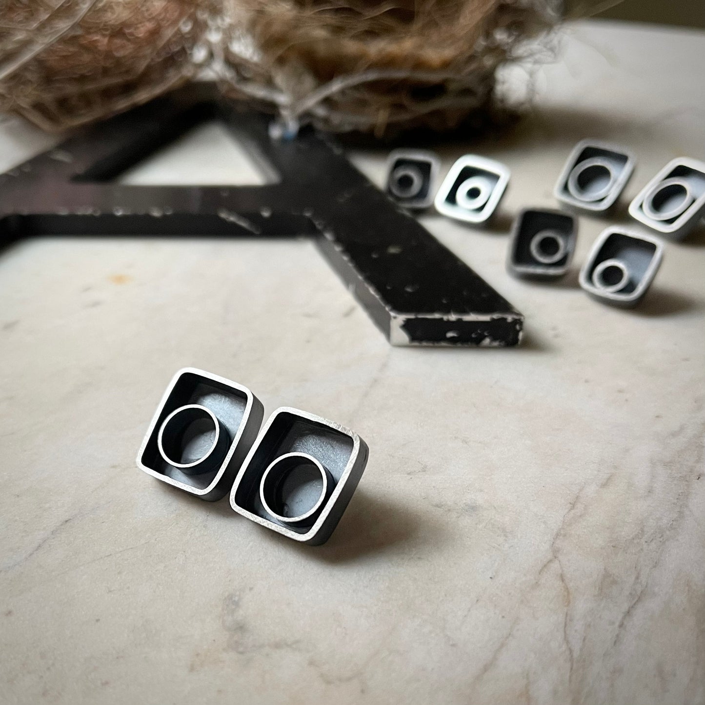 Large earrings with silver circle framed in a rectangle