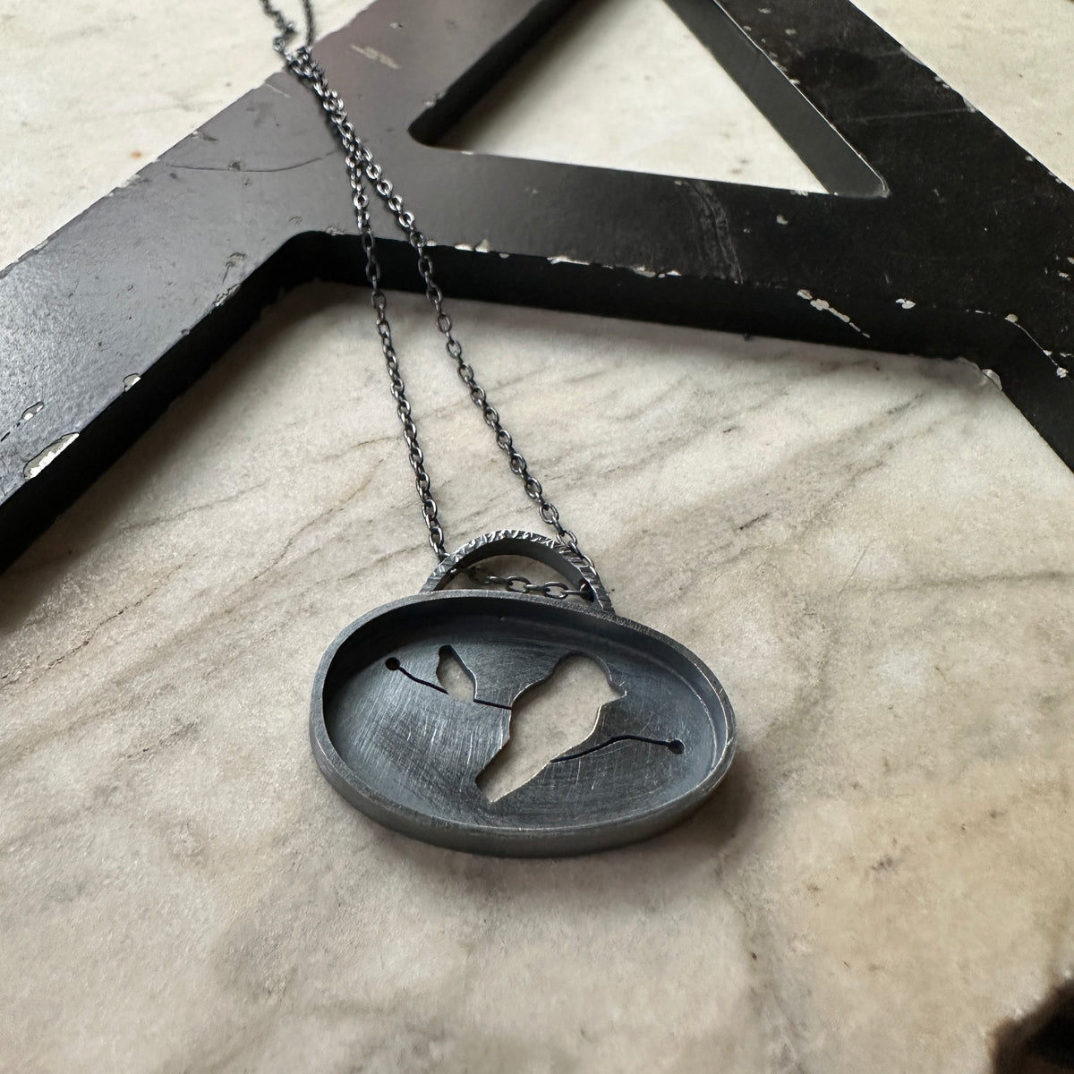 Oxidized sterling silver bird pendant, dark and moody, modern silhouette