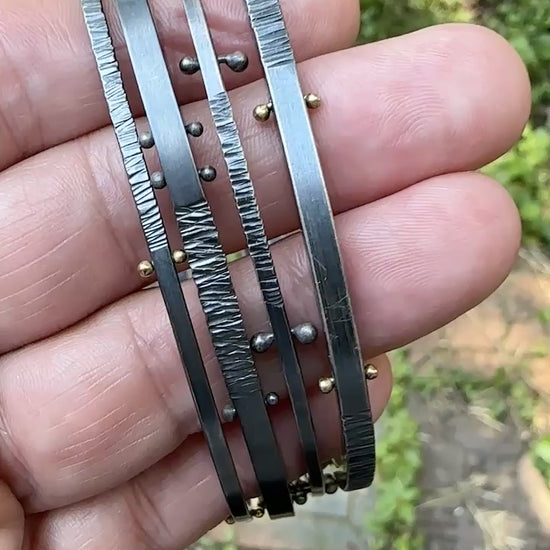 A movie showing how all four oxidized silver bangle bracelets look from all sides.
