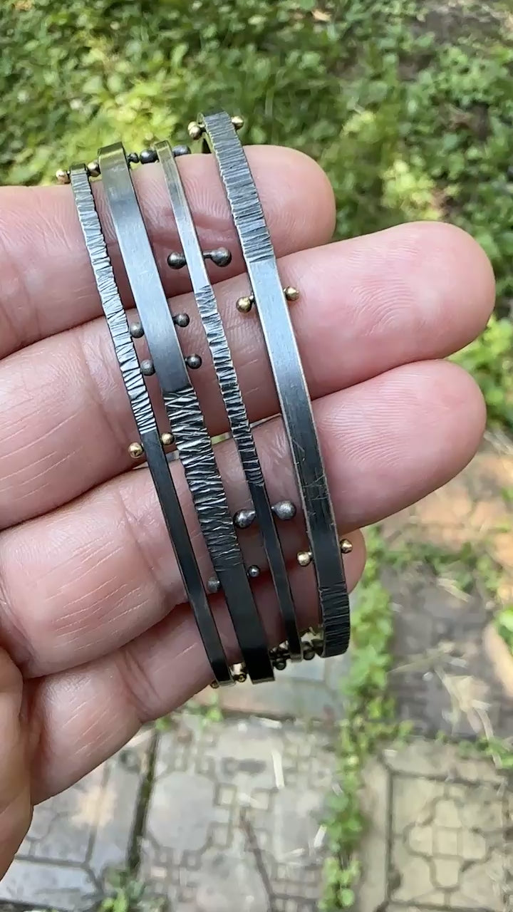 A movie showing how all four oxidized silver bangle bracelets look from all sides.