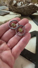 Load and play video in Gallery viewer, circular earrings with a yellow rose cut diamond suspended in the center.  The diamonds are set in 18k yellow gold and are suspended by three rivets to the outer circle. 
