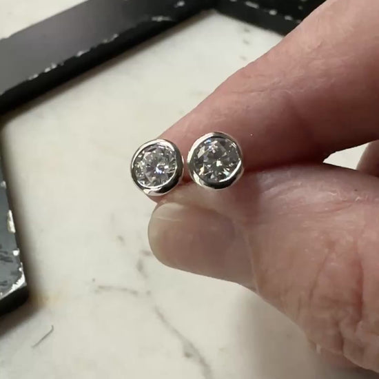 a video or 5mm bezel set sterling silver Moissanite stud earrings