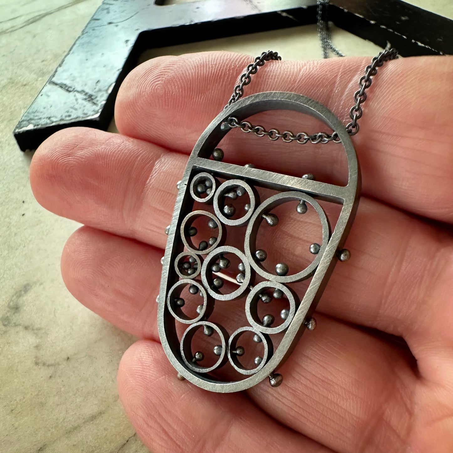 modern oxidized sterling silver pendant handmade by Ann Hartleystudio