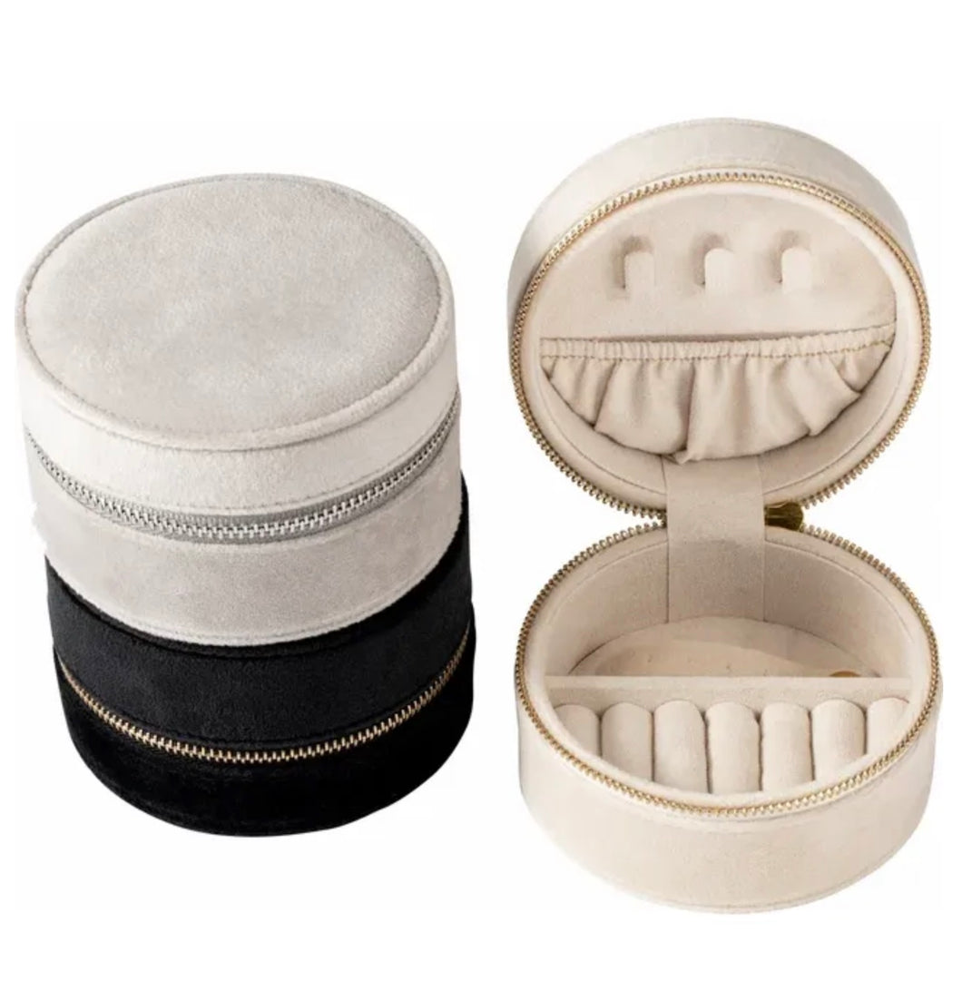 round, velvet jewelry travel cases in silver, black and ivory