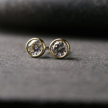 Load image into Gallery viewer, a pair of yellow gold Moissanite stud earrings
