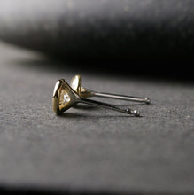Load image into Gallery viewer, a pair of yellow gold Moissanite stud earrings shown from the side to show sterling silver posts 
