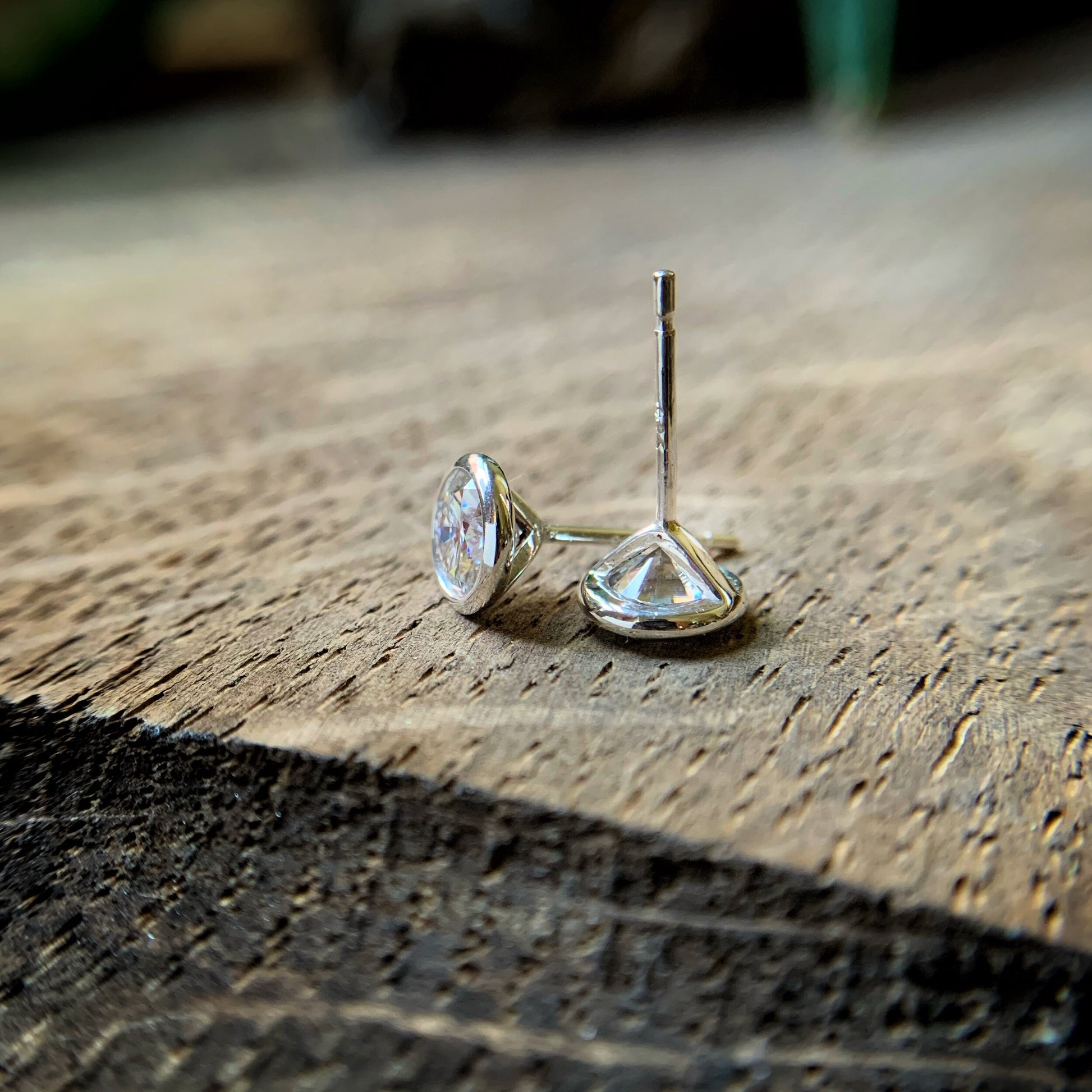 a pair of 6mm Moissanite studs.  Photographed to show the earring posts.  