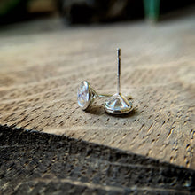 Load image into Gallery viewer, a pair of 6mm Moissanite studs.  Photographed to show the earring posts.  
