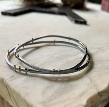 Load image into Gallery viewer, two asymmetrical bangle bracelets showing the option for gold rivets
