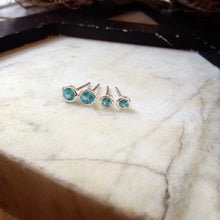 Load image into Gallery viewer, two sizes of bright blue topaz set in sterling silver bezels
