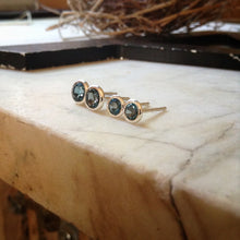 Load image into Gallery viewer, 4mm and 5mm London blue topaz earrings together showing size difference
