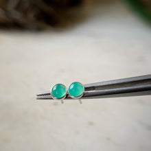 Load image into Gallery viewer, chrysoprase stud earrings shown in a tweezers for scale
