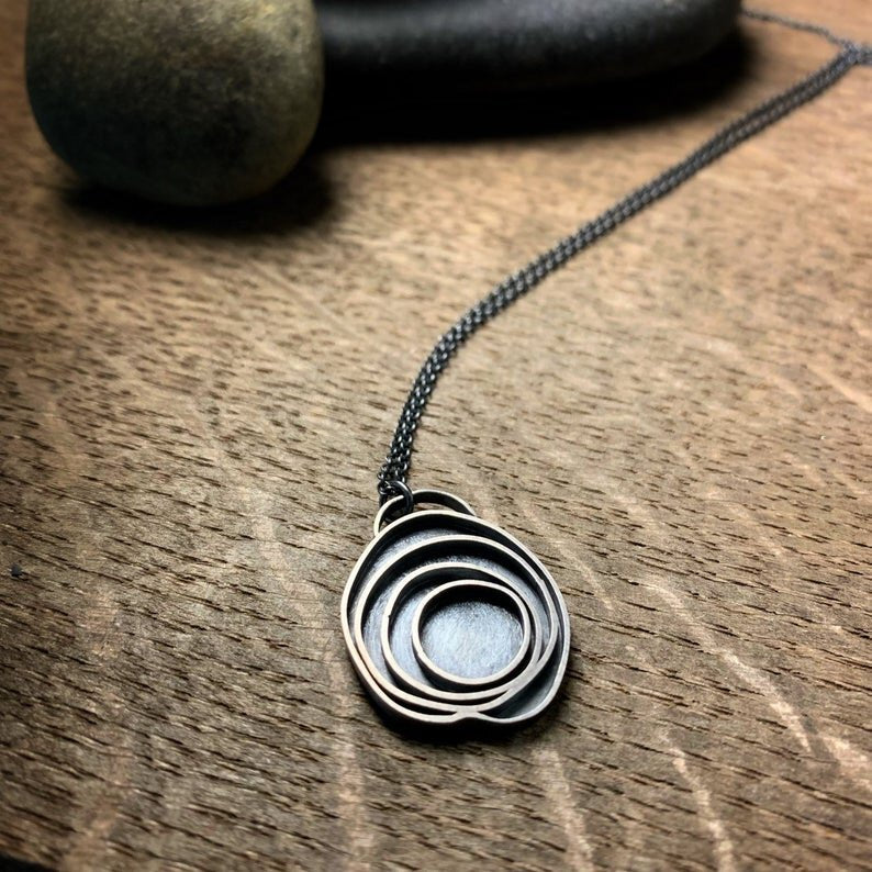 oxidized sterling silver pendant with concentric circles