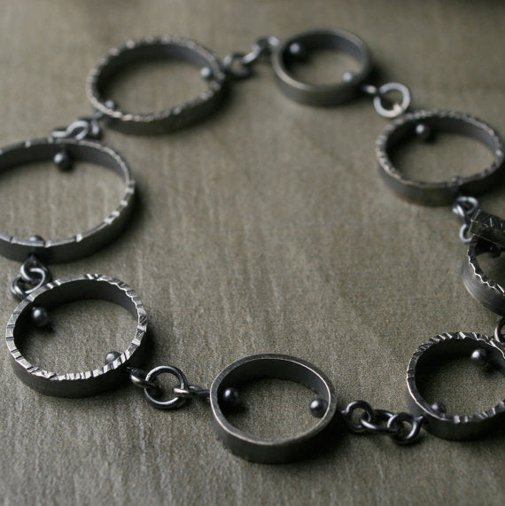 oxidized circle link bracelet with texture in oxidized sterling silver.