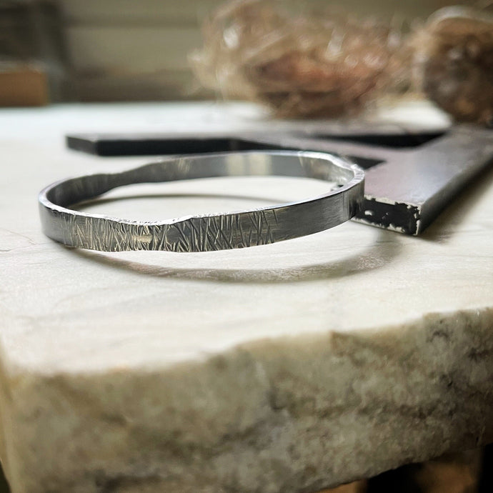 bangle bracelet with textured skinnier sections