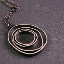 Load image into Gallery viewer, another version of oxidized sterling silver pendant with concentric circles
