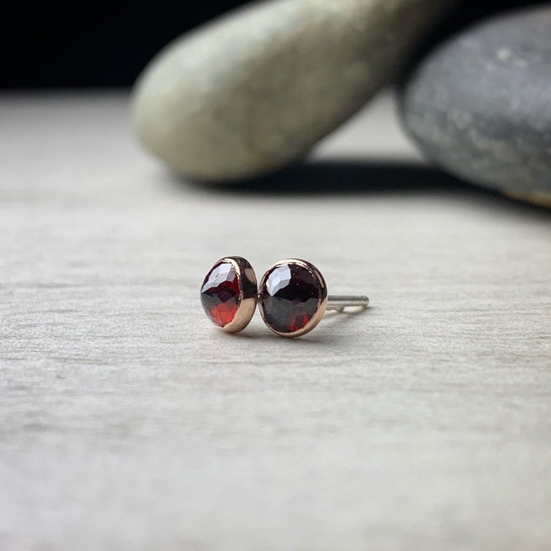 5mm micro faceted garnet bezel set garnet stud earrings shown with rose gold bezels