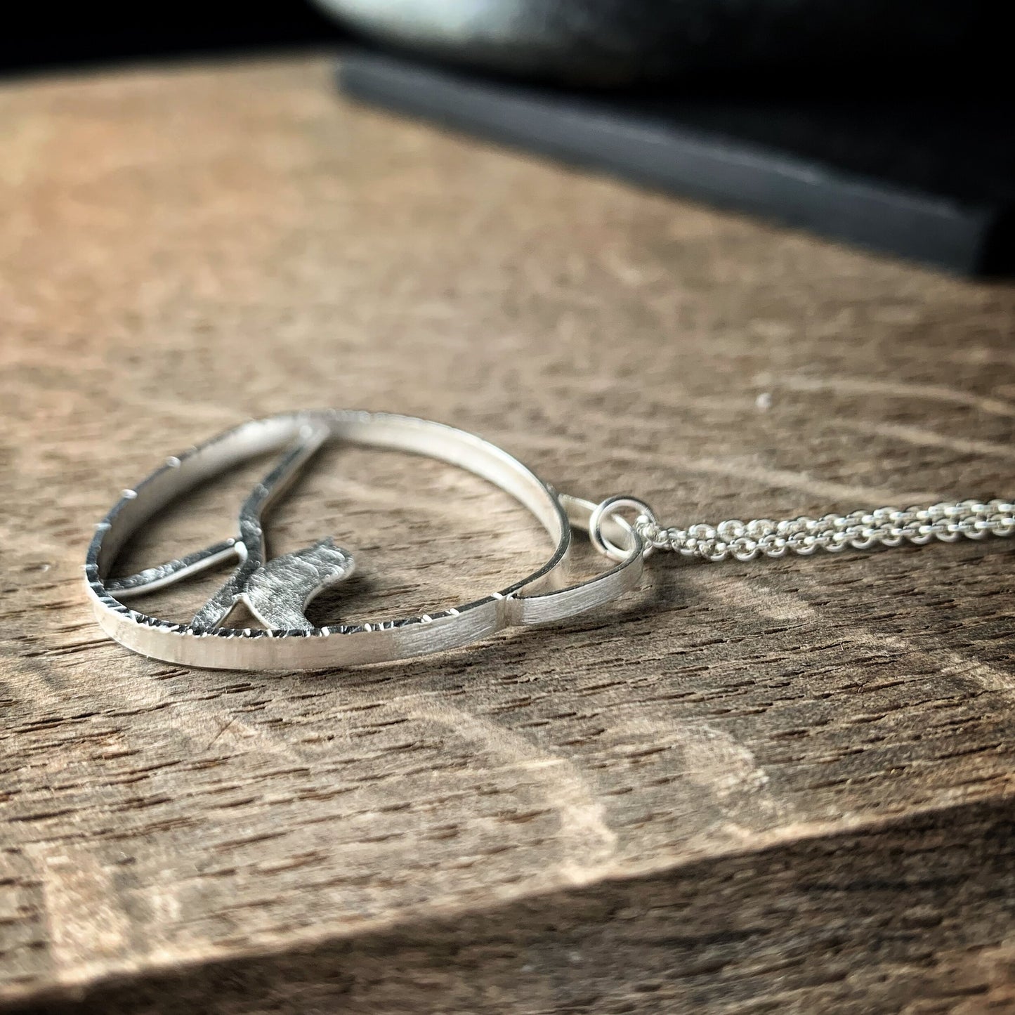 Sterling silver bird on a branch pendant