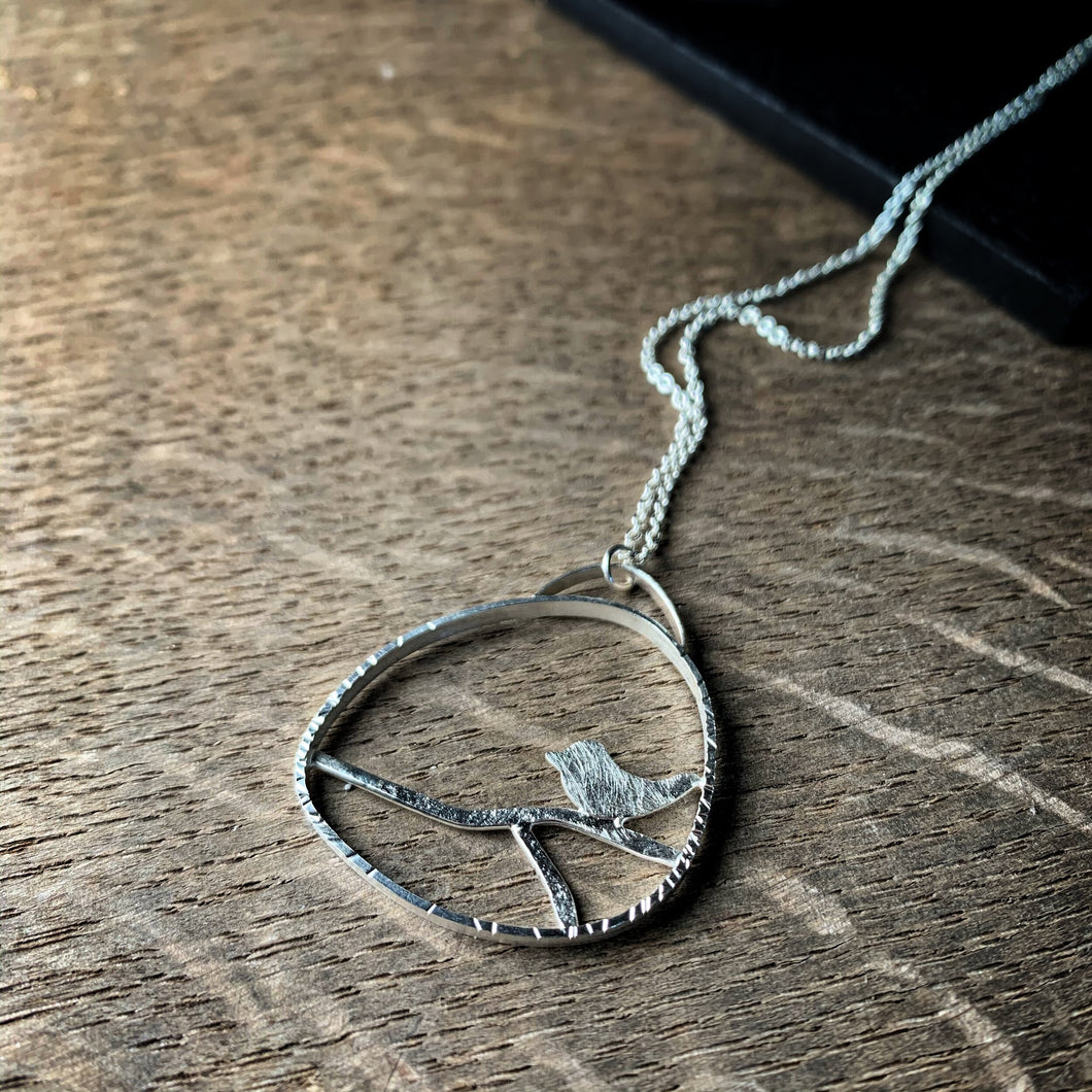 Sterling silver bird on a branch pendant