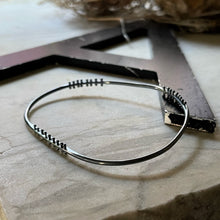 Load image into Gallery viewer, oxidized silver bangle bracelet with three stations of silver pins
