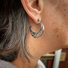 Load image into Gallery viewer, half moon shaped hoop earrings shown on a model

