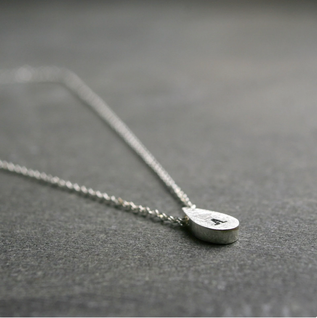 Tiny teardrop initial pendant