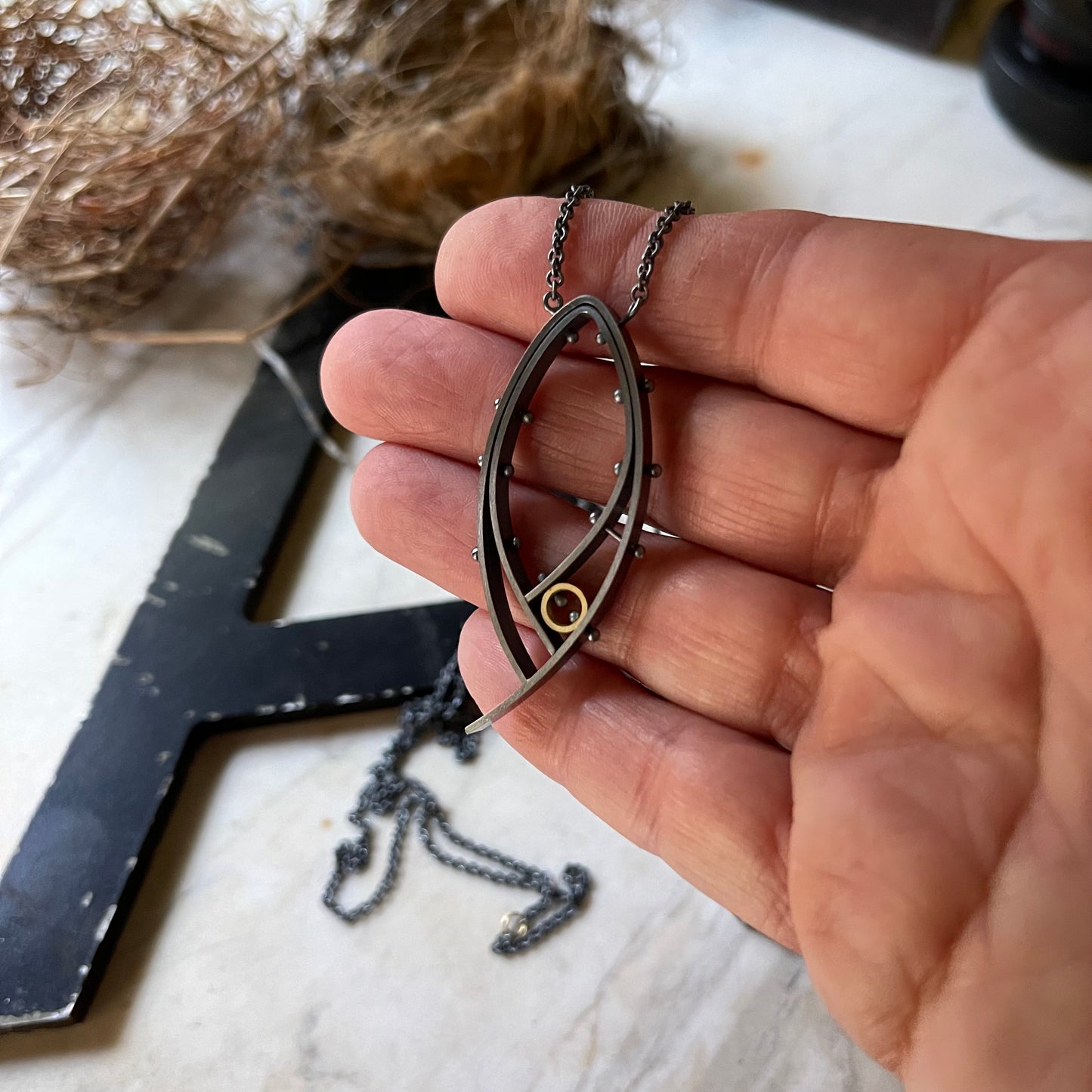 Oxidized silver and 18k yellow gold riveted modern pendant