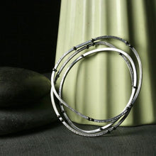 Load image into Gallery viewer, three asymmetrical bangle bracelets with rivets and texture
