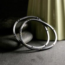 Load image into Gallery viewer, two heavyweight asymmetrical bangle bracelets with both silver and gold rivets
