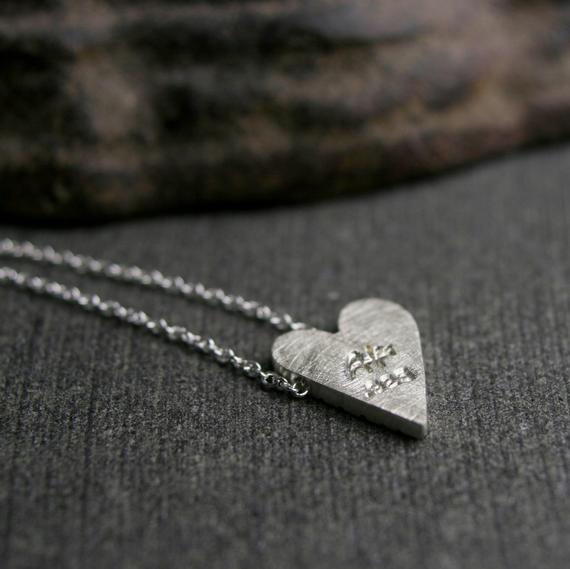 Sterling silver tiny cut heart pendant, cut texture with a brushed finish