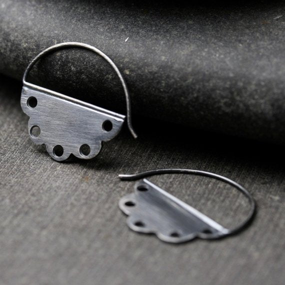 scalloped edge sterling silver hoop earrings with holes.