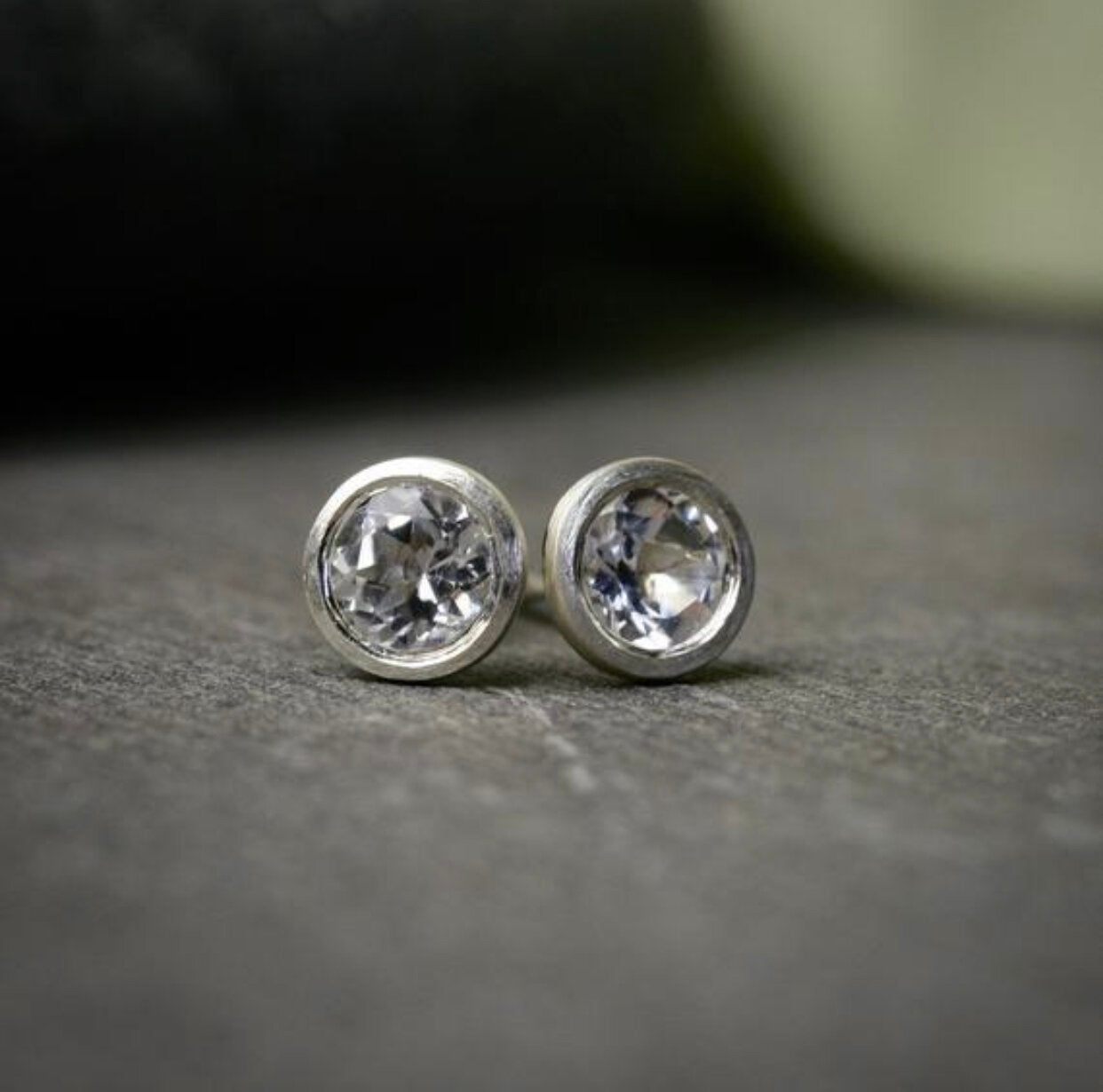 bezel set white topaz stud earrings in sterling silver