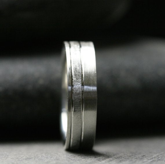 6mm sterling silver band with offset textured stripe shown from the front to show detail