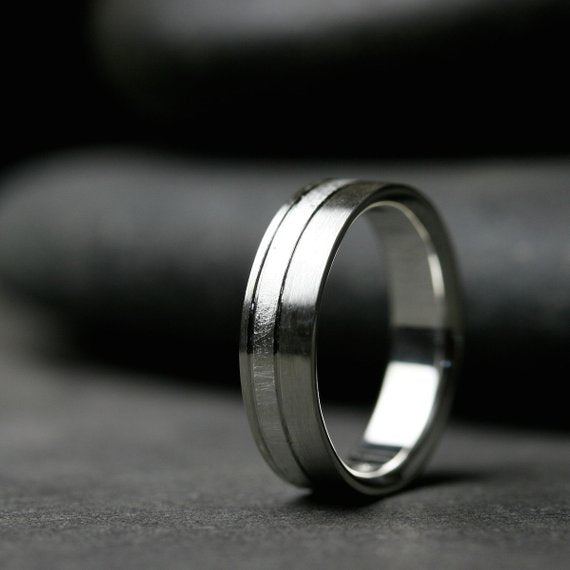 6mm sterling silver band with offset textured stripe shown to display comfort fit