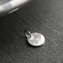 Load image into Gallery viewer, tiny disc with hammered texture showing the back of the pendant
