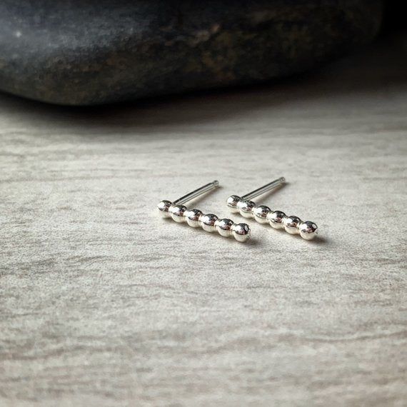 Tiny sterling silver beaded bar stud earrings, front view