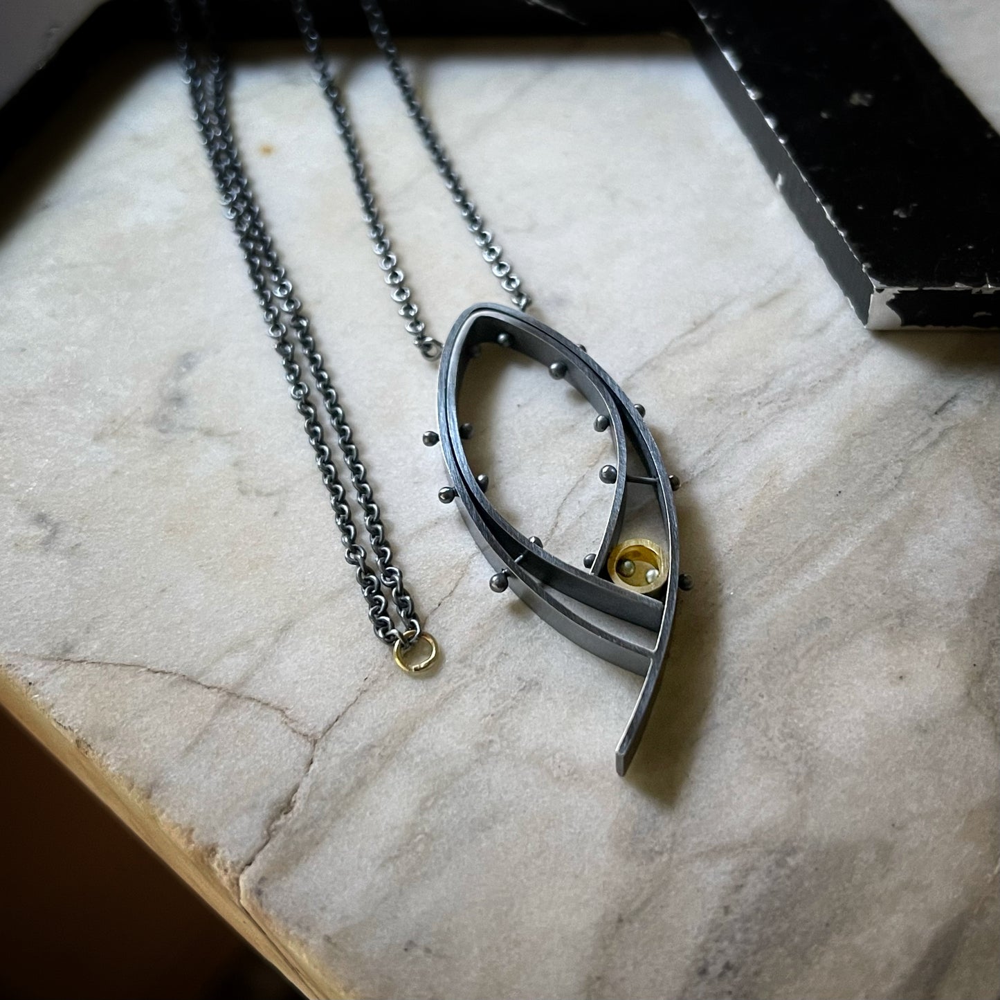 Oxidized silver and 18k yellow gold riveted modern pendant